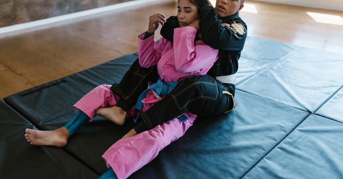 A martial artist securing the back mount on an opponent, demonstrating dominant submissions for our BJJ positions explained overview.